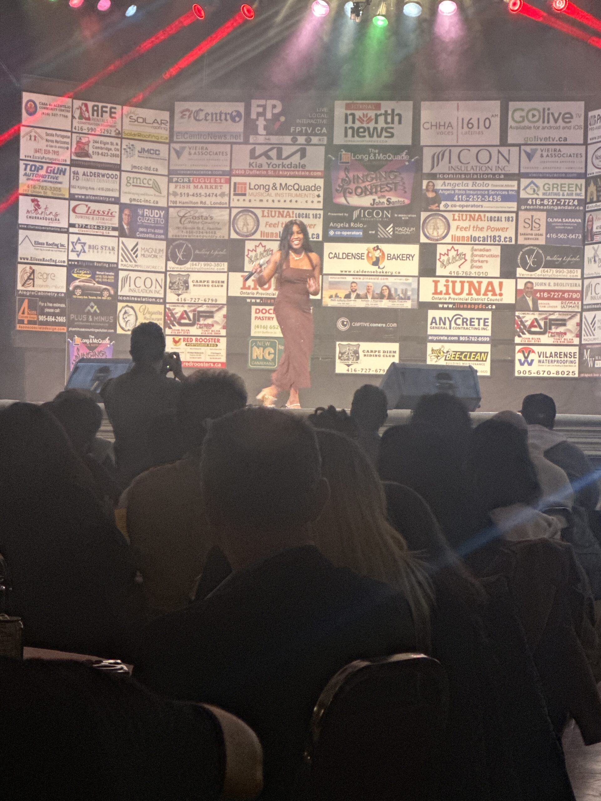Dianela Hernandez Oxamendis performing Bidi Bidi Bom Bom at the Singing Contest with John Santos.